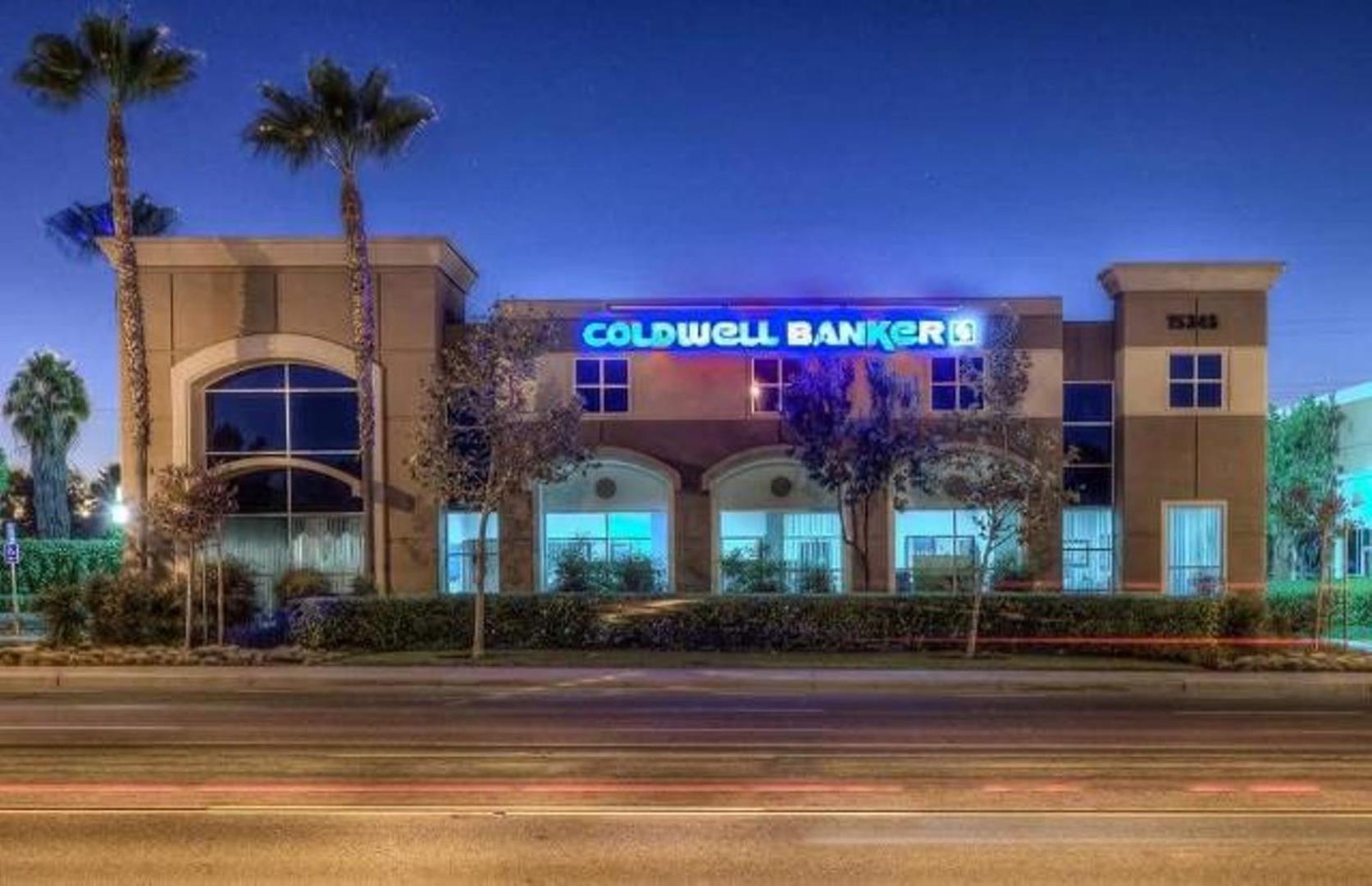 Coldwell banker top team main office building in Chino, California with beautiful palm trees